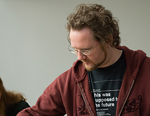 Aaron Gustafson makes an effort to listen as he plays with Lego bricks